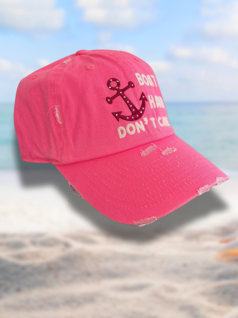 Boat Hair Don't Care - Distressed, Embossed, Ladies Hat with Anchor Detail in Vintage Neon Pink with Iridescent Rhinestones on Anchor Detail, Angled View.