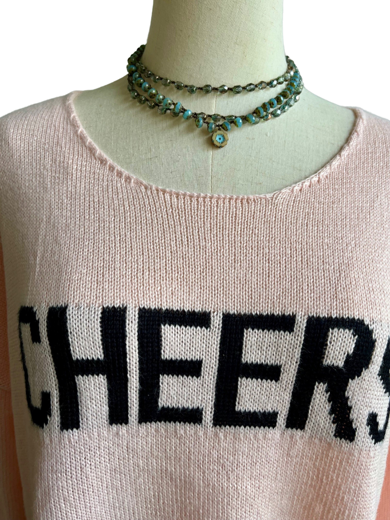 Cheers Ladies Sweater Close Up with Sand and Sky Necklace and Sea Green and Grey Long Crystal Necklace