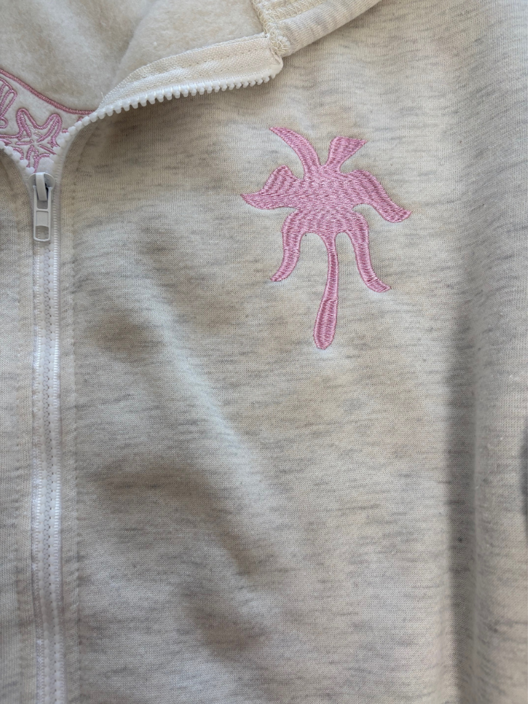 Coastal Bloom Hibiscus Embroidered Zip-Up Ladies Hoodie, Close Up, Shows Palm Tree on Upper Left Chest