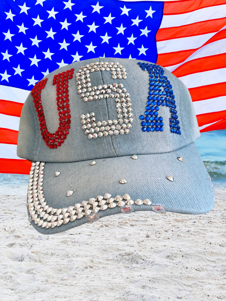 Denim cap with 'USA' in red, white, and blue on an American flag background.