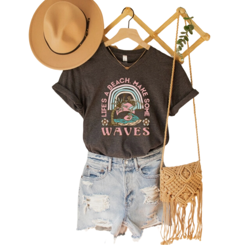 Life's a Beach, Make Some Waves, ladies crew neck, unisex fit, t-shirt. Features skeleton surfing design. Lifestyle front view image