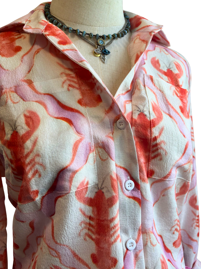 Lobster Print Button-down Ladies Blouse Close Up View on Form with Sand and Sky Pressed Crystal Necklace and Eyes of Protection Necklace.