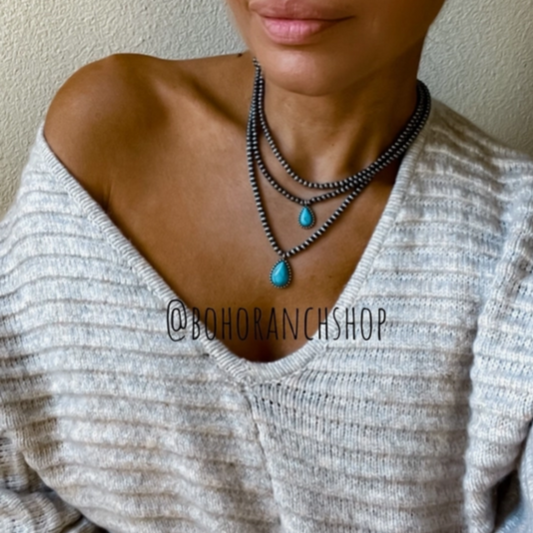 Multi Layered Teardrop Navajo Necklace - Turquoise Stones and Burnished Silver Beads. Shown on Model
