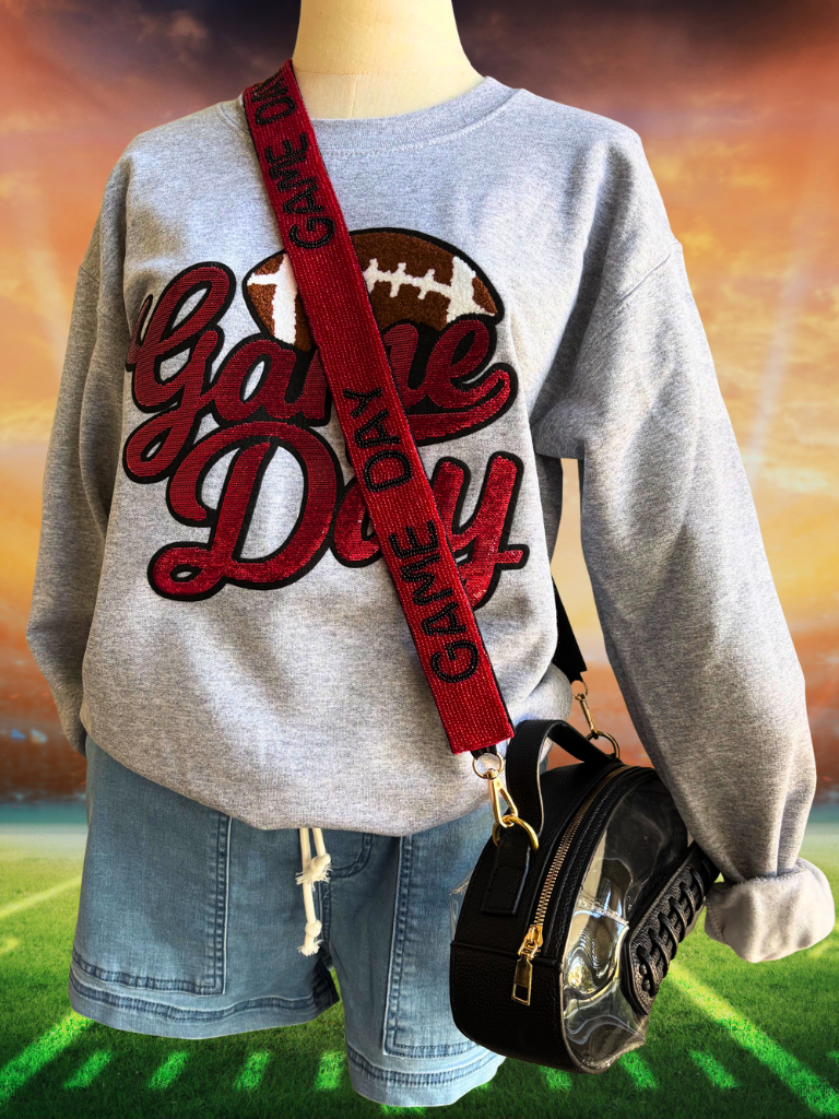 Red Sequin "Game Day" Lettering & Chenille Football Patch, Crewneck Sweatshirt in Sport Grey, Shown on a Form, Full Front View, Also Showing our Clear Football Purse and Beaded Game Day Strap.