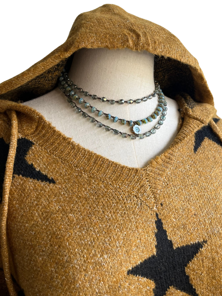 Stars Pattern Hoodie Sweater Front View Close Up with Necklaces