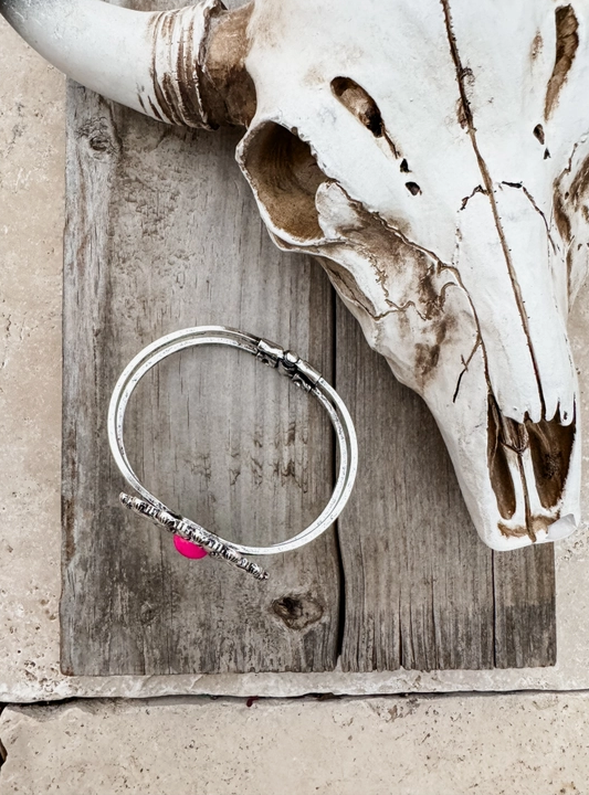 Navajo Boho Style Concho Bracelet - Fuchsia Stones in Burnished Silvertone Setting. Top/ Side View on a Weathered Board.