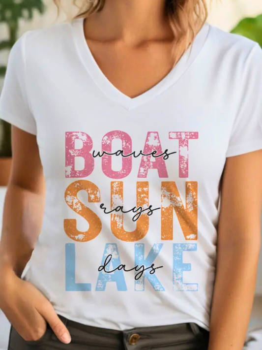 White t-shirt with colorful text 'BOAT WAVES SUN DAYS LAKE' shown on a model.