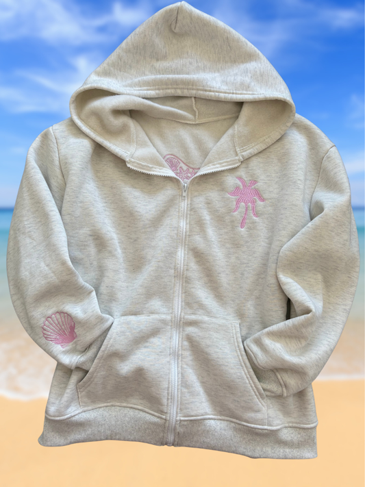 Coastal Bloom Hibiscus Embroidered Zip-Up Ladies Hoodie Front Flat Lay Shows the  Embroidered Palm Tree on Upper Left Chest and Shell on the Sleeve.