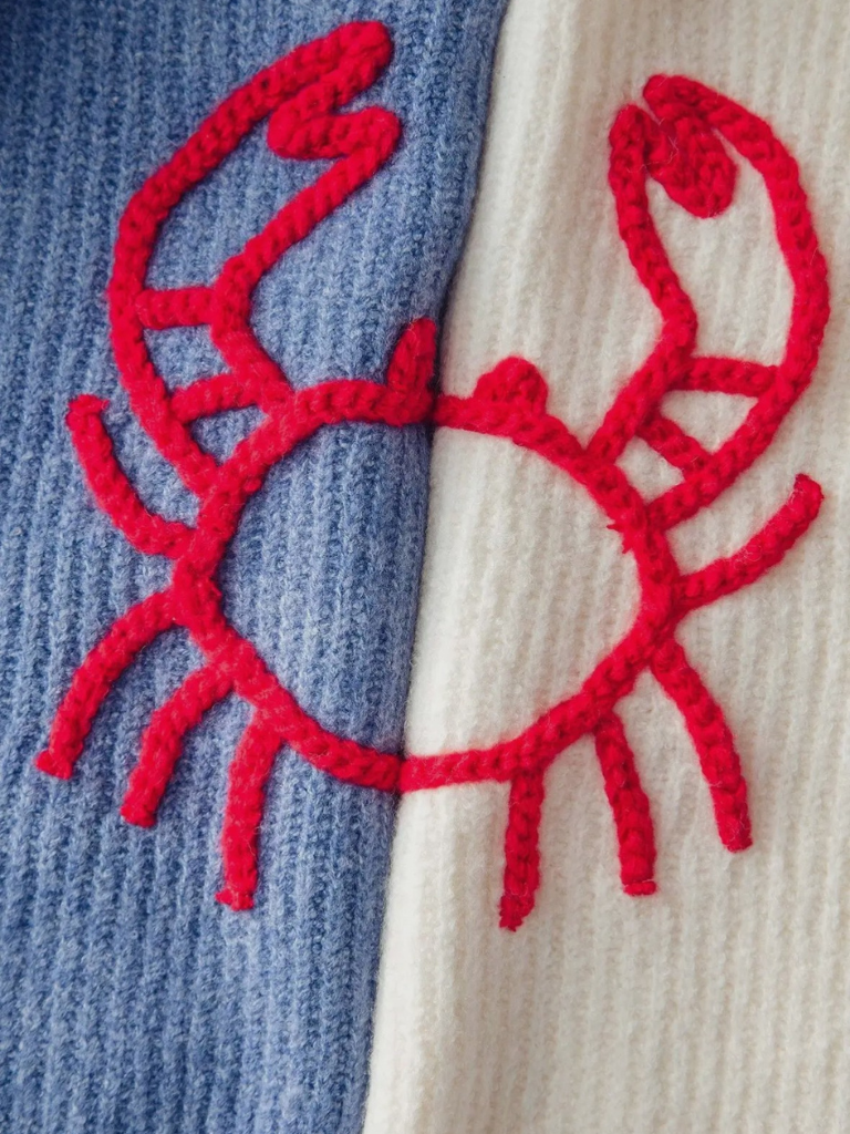 Feelin' Crabby Chunky Knit Embroidered Sweater, Very Close Up Detail View of Embroidered Yarn, Bold Red Crab Motif on an Ivory Sweater.