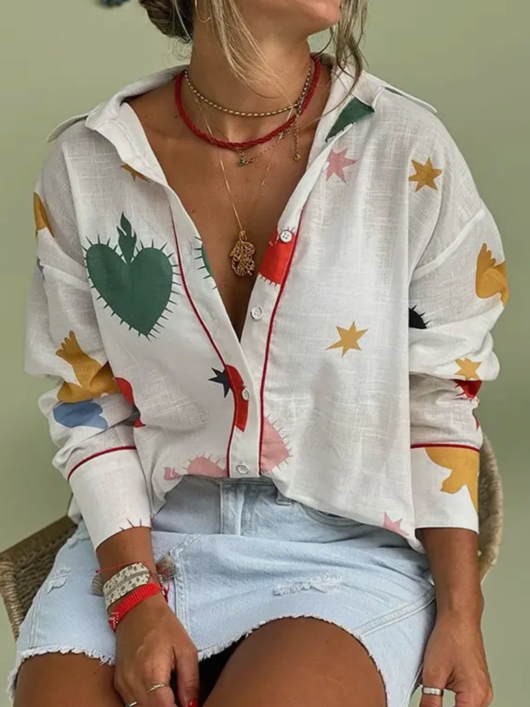 Hearts and Stars Long Sleeve Blouse Front View on Model in Denim Skirt