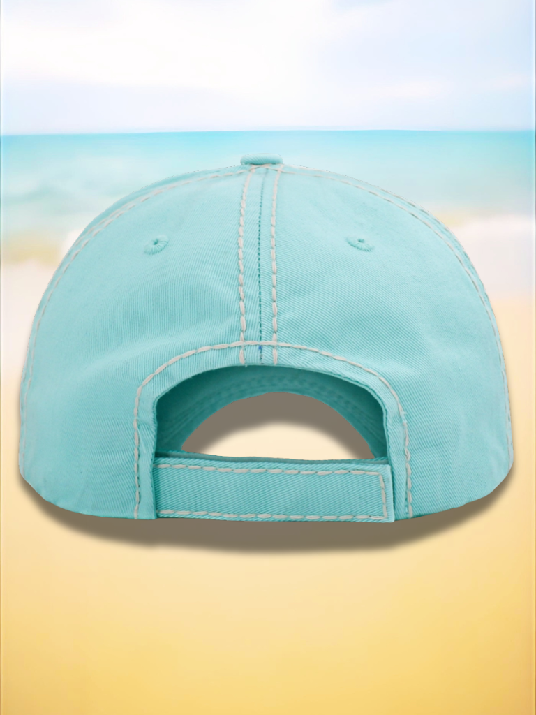 Light blue baseball cap on a beach background. back view