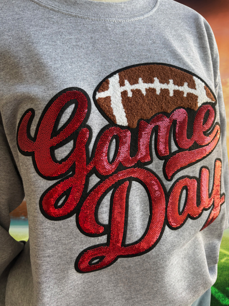 Close Up View of Red Sequin "Game Day" Lettering & Chenille Football Patch, Crewneck Sweatshirt in Sport Grey.