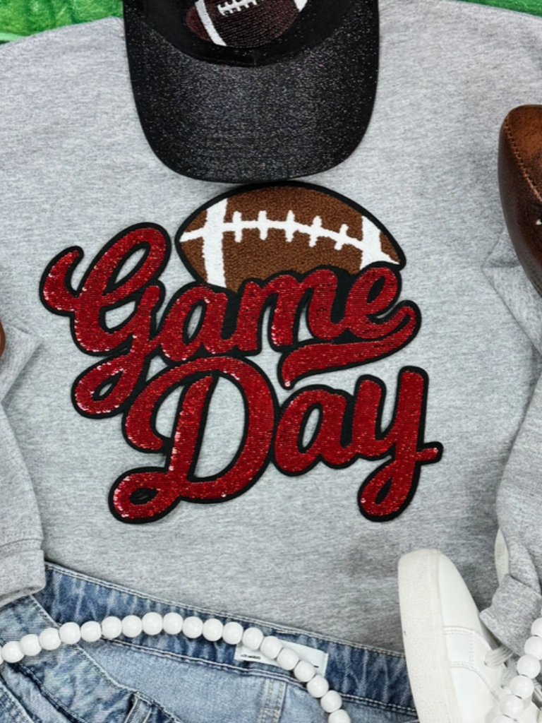 Red Sequin "Game Day" Lettering & Chenille Football Patch, Crewneck Sweatshirt in Sport Grey, Flat Lay View.