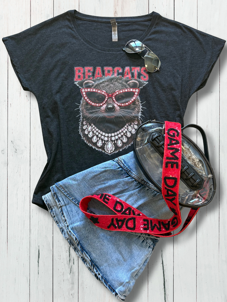 Uptown Glam UC Bearcat Scoop Neck Tee on Flat Layout with our denim mini skirt, football shaped stadium back and sequin / beaded purse strap