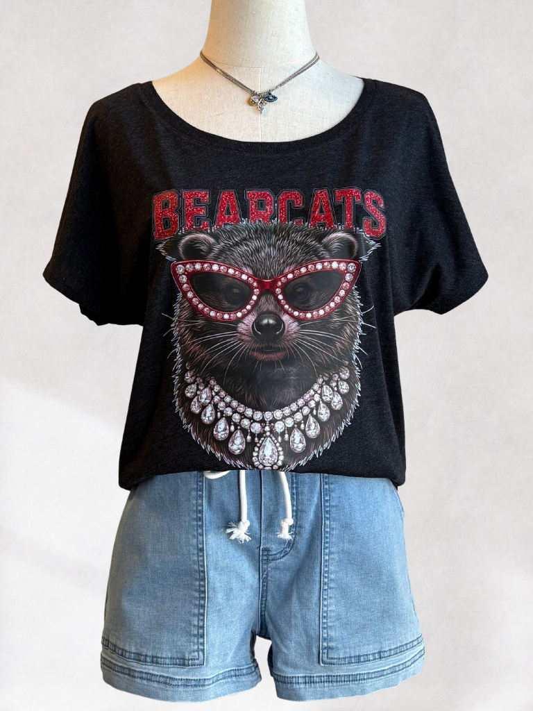 Uptown Glam UC Bearcat Scoop Neck Tee on Form in the weekend wanderer shorts with eyes of protection necklace.